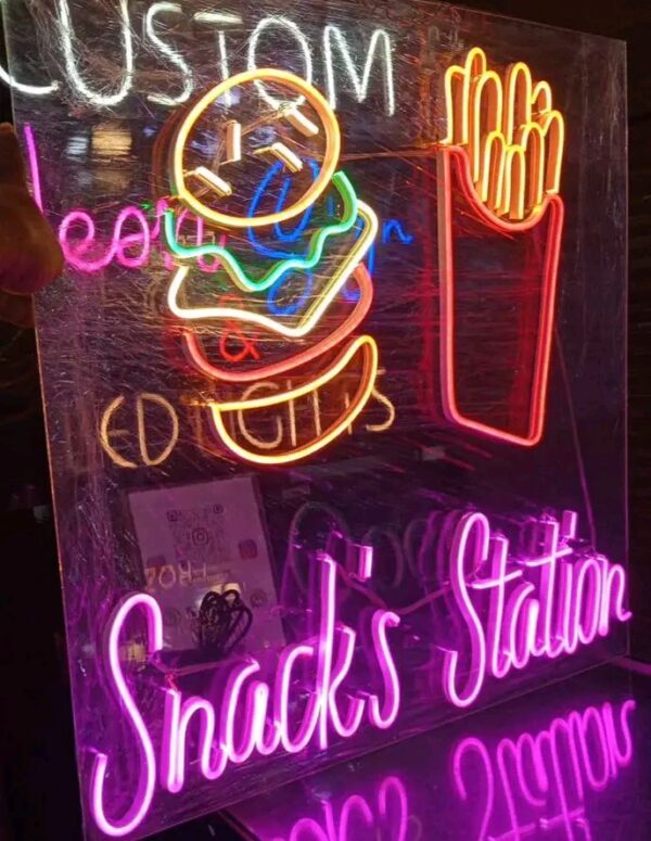 Functional signs for storefronts including "OPEN", "SALE", and branded logos for "Snack Station".