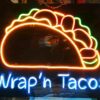 Functional signs for storefronts including "OPEN", "SALE", and branded logos for "Wrap N Tacos".