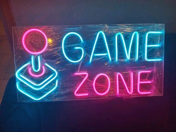 Functional signs for storefronts including "OPEN", "SALE", and branded logos for "Game Zone".