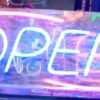 Functional signs for storefronts including "OPEN",